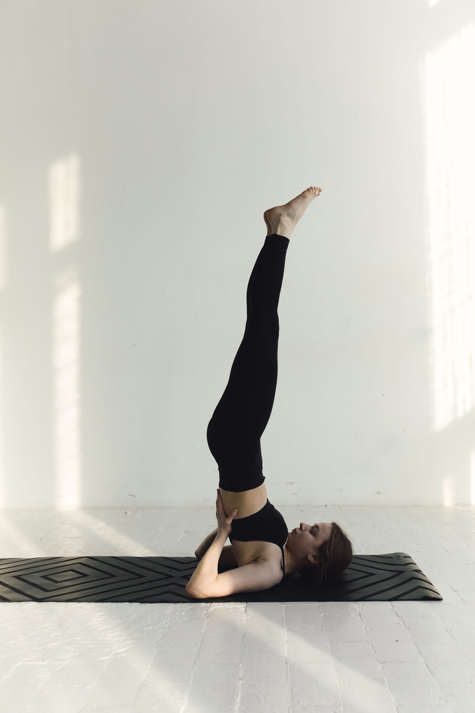 Legs-up-the-wall pose in a yoga for thyroid routine