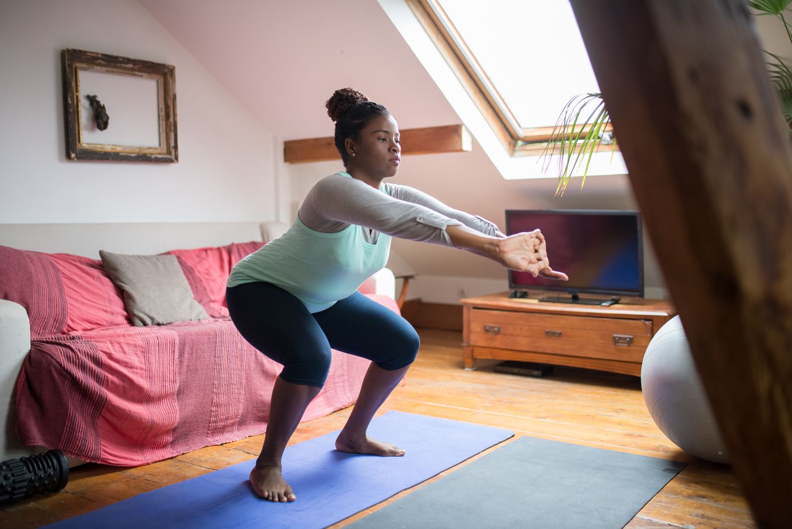 A beginner practising yoga at home