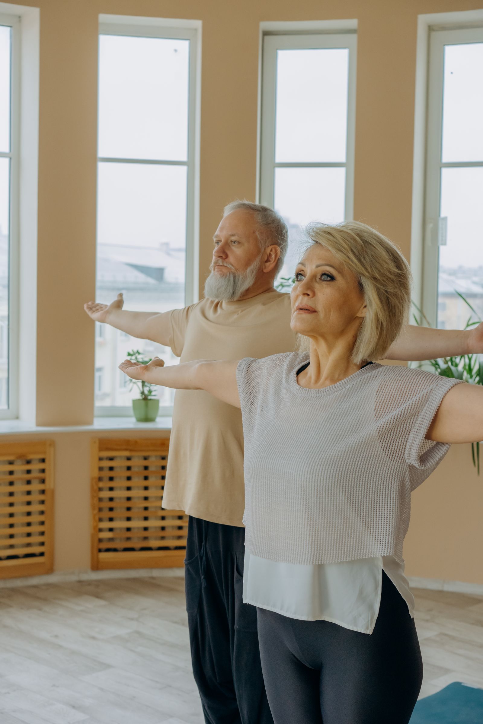 Active older adults enjoying a gentle yoga for seniors class