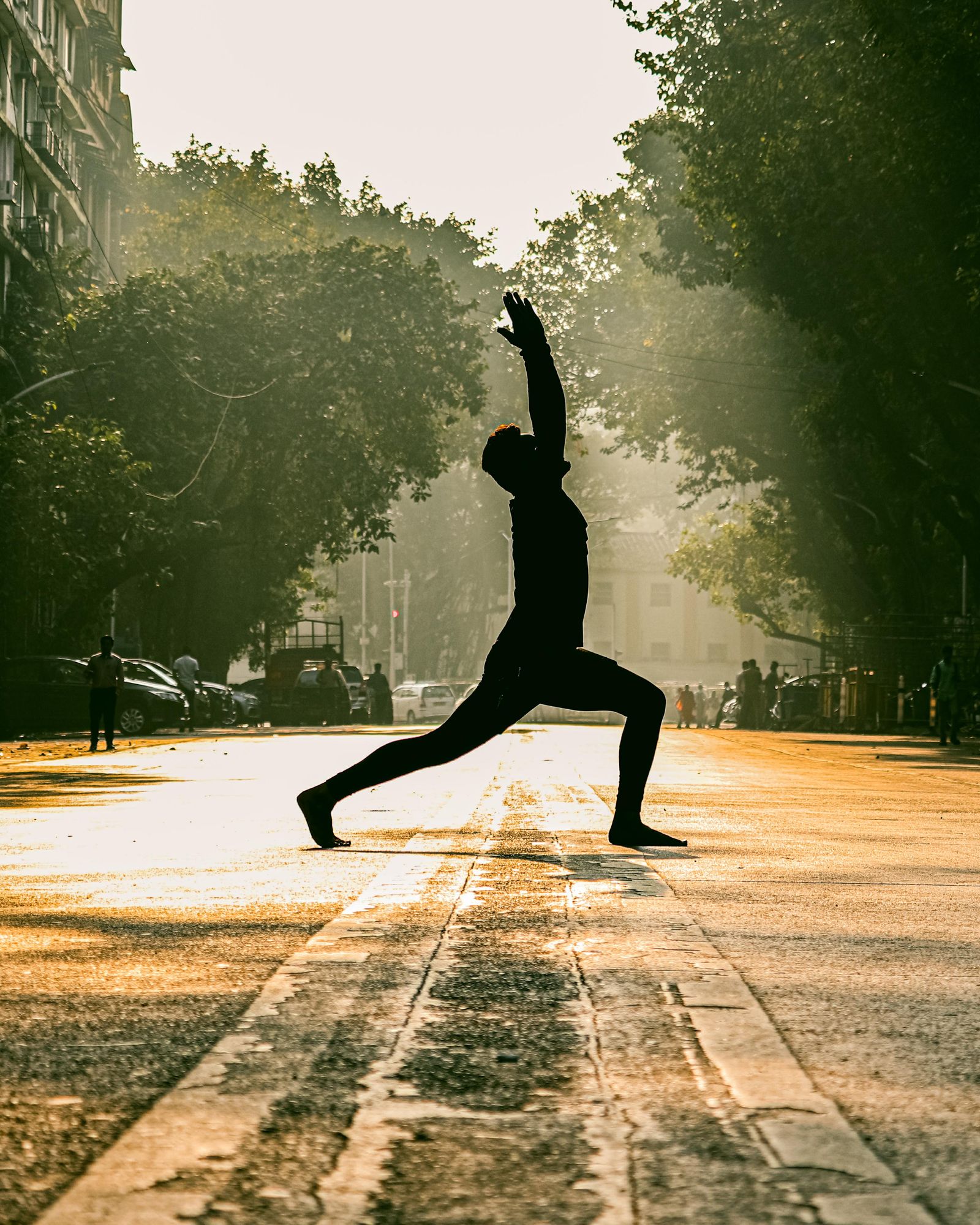 A yogi at sunrise, weighing 100-hour vs 200-hour yoga teacher training