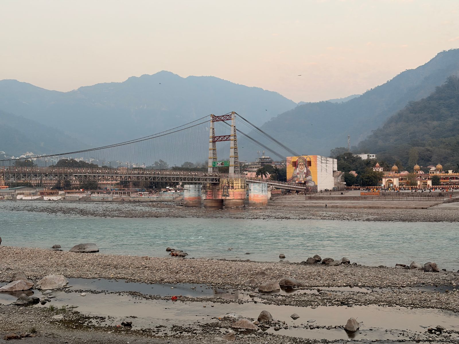 The Ganges and Ram Jhula bridge, part of choosing the best time for yoga teacher training in Rishikesh
