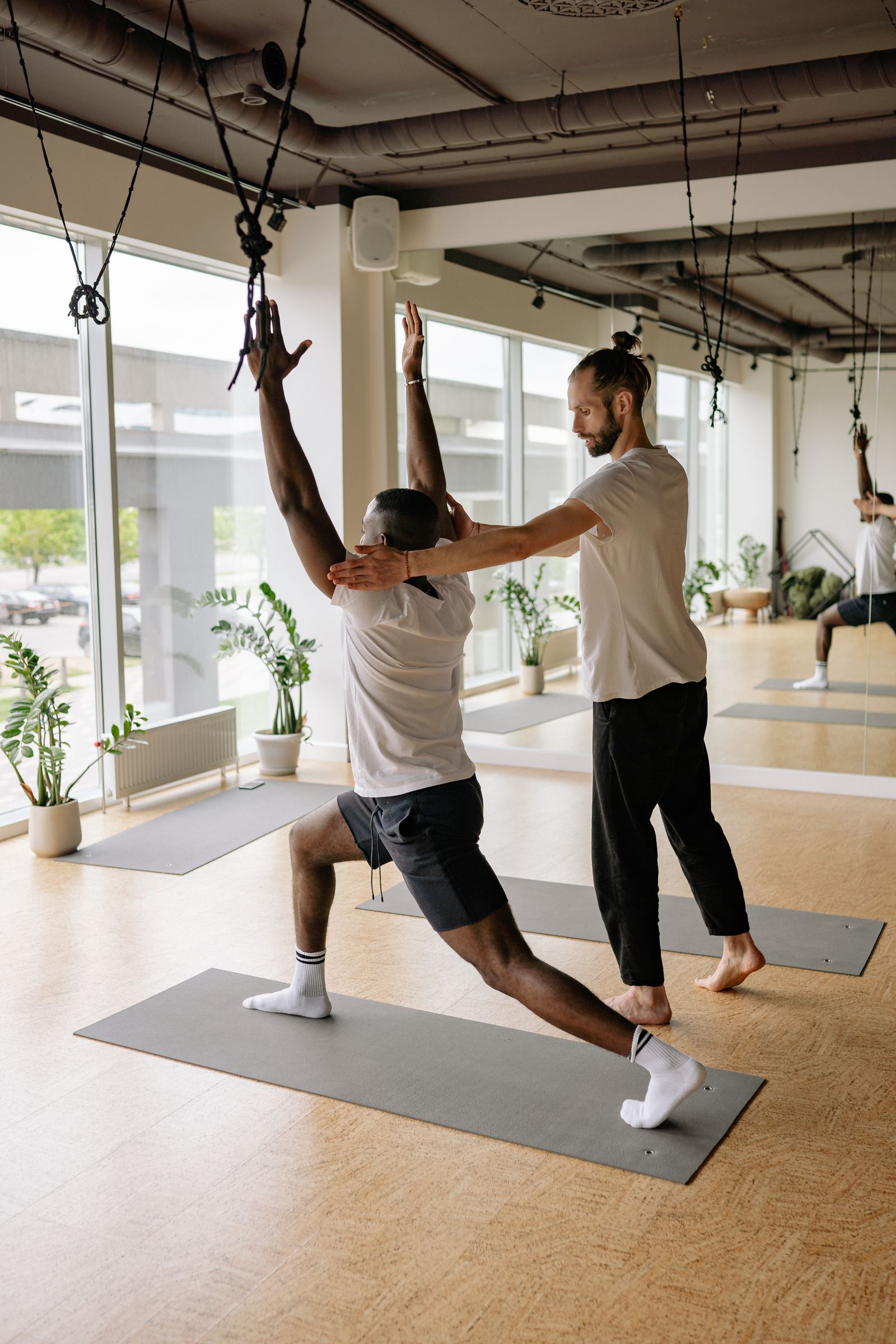 A teacher instructing a class, showing how much yoga teachers earn